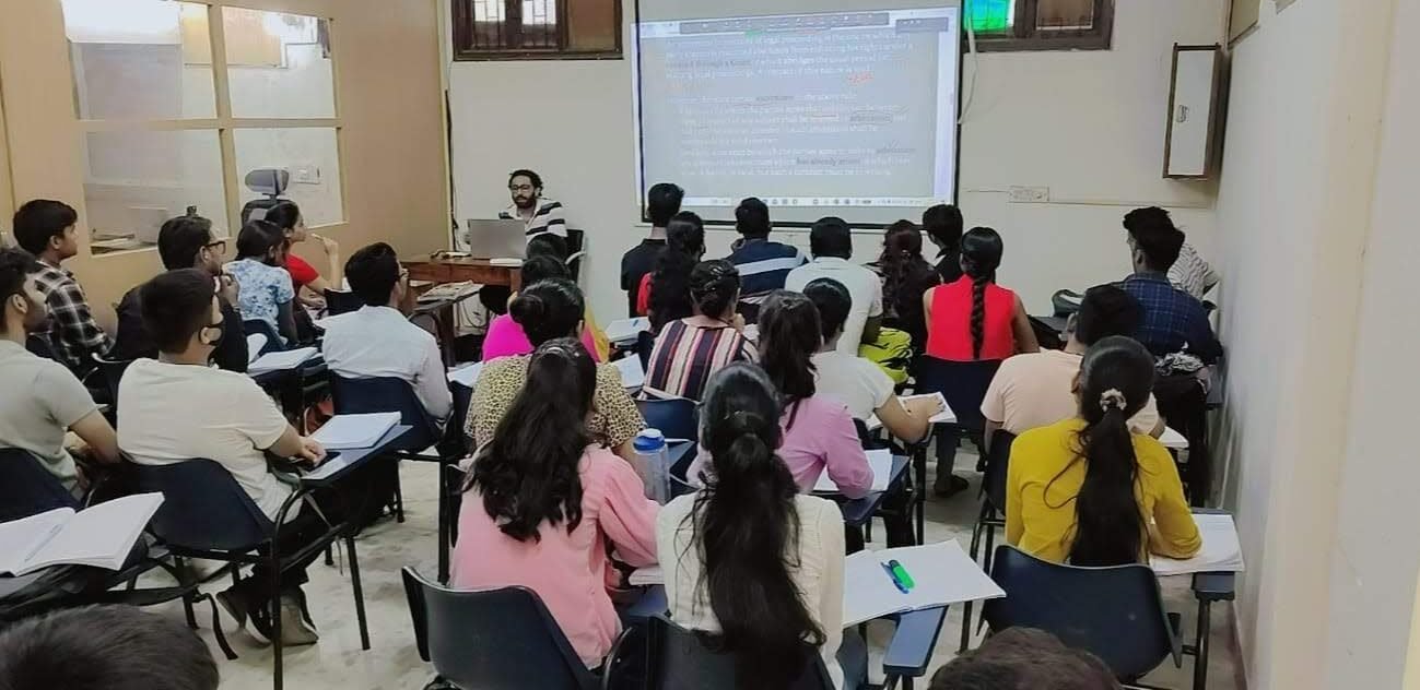 Students attending a projector-based Commerce lecture